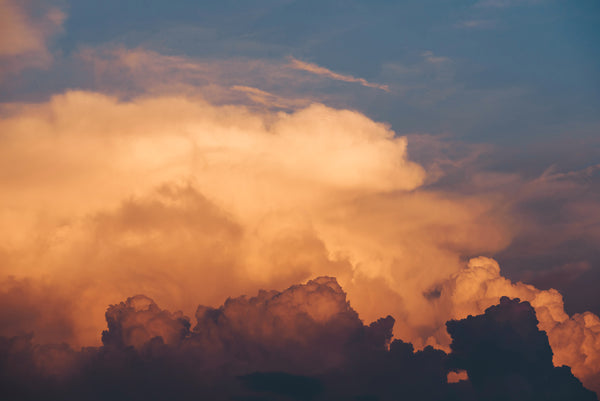 Golden clouds in moody sky for Zodiaque Moon monthly horoscopes