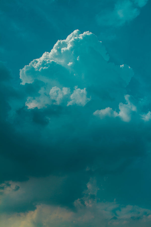 Moody teal blue cloudy sky for Zodiaque Moon monthly horoscopes